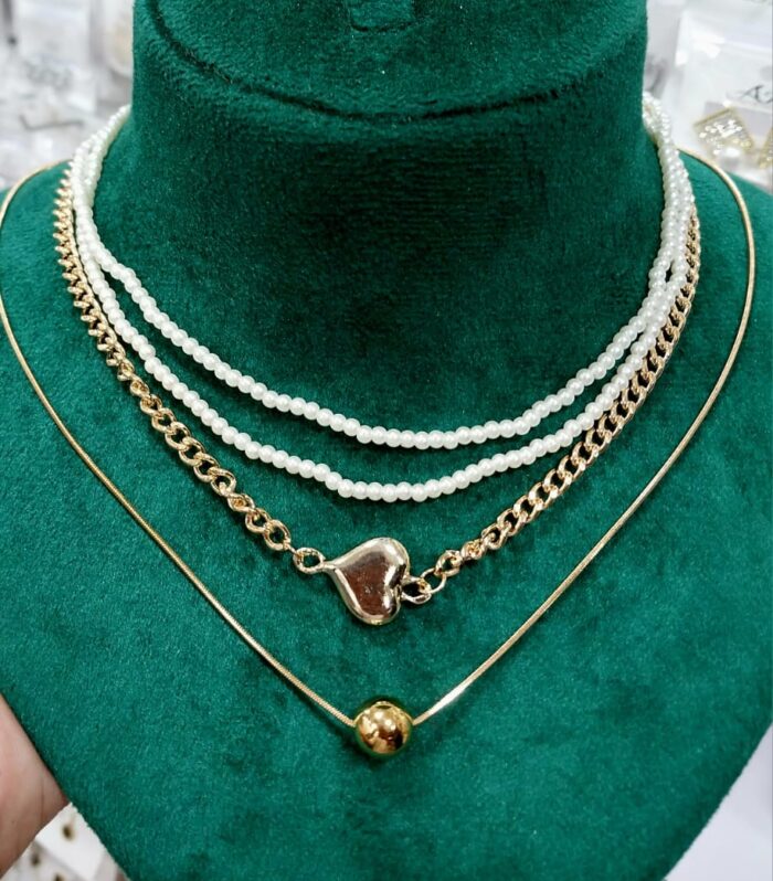 Layered golden necklace with white pearl